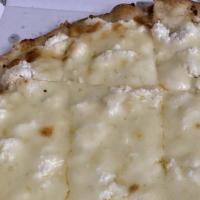 White Pizza · Ricotta, parmigiano and mozzarella blanketing a layer of caramelized onion and roasted garli...