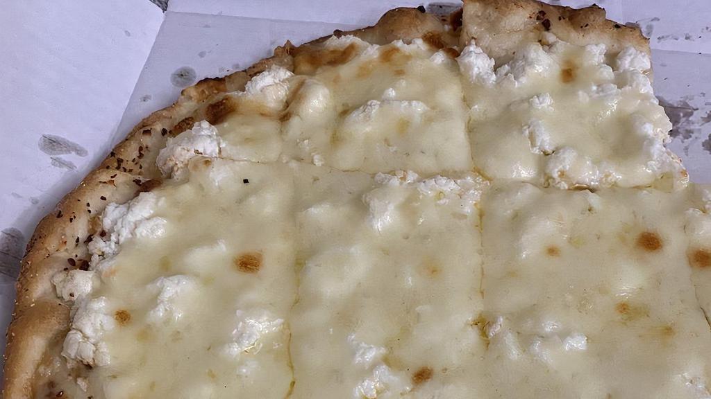 White Pizza · Ricotta, parmigiano and mozzarella blanketing a layer of caramelized onion and roasted garlic on top of a garlic buttered crust. Served with thin crust.
