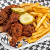 Wings · Served on white bread with seasoned fries and pickles. Your choice of heat, mix and match.