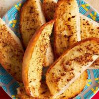 Garlic Sticks · Baked Portuguese roll, cut in strips, and smothered in garlic-herb spread and grilled.