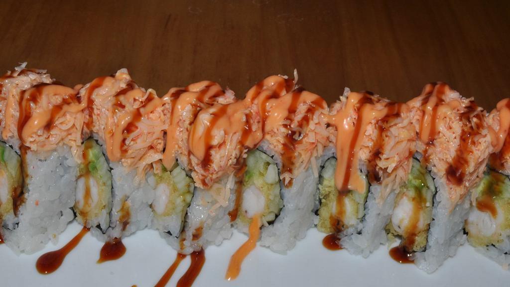 Paradise Roll · In: shrimp tempura, cucumber and avocado.

Out: spicy crab meat and massago.

These items are served raw or under cooked or may contain raw or under cooked ingredients.