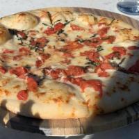 Margherita Pizza · marinara, Daiya cheese,
tomato, fresh basil