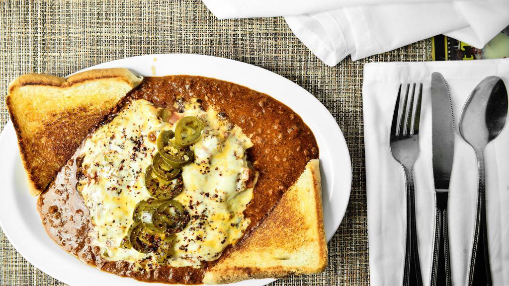 Mexican Steak · A tasty creation!
Hamburger steak covered with green chilies, pepper jack cheese, and topped with jalapeno peppers; served on a platter of Ron's award-winning homemade chili, with a side of Texas toast. Fried onion upon request.