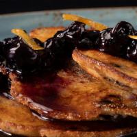 Blueberry Cornmeal Pancakes · Whipped butter, candied lemon zest