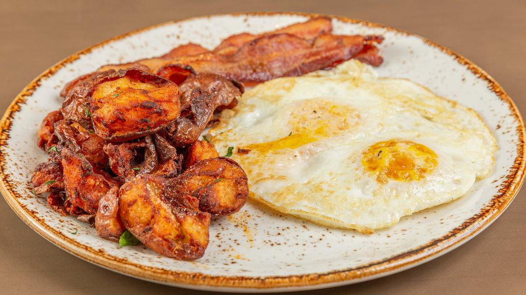 Your Way · Two eggs any style, choice of sausage or bacon, breakfast potatoes, and choice of toast.
