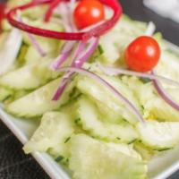 Cucumber Salad · cucumbers, cherry tomatoes, red onions, carrots, beets, lettuce, with cucumber dressing.