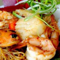 Spicy Seafood Noodles · shrimp, scallops, calamari, mussels, egg noodles, basil leaves, peapods, red bell peppers, j...