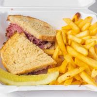 Large Corned Beef Sandwich Combo · Salt cured beef sandwich. Includes your choice of chips, steak fries or onion rings and can ...