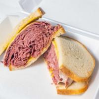 Large Corned Beef Sandwich · Salt cured beef sandwich. All sandwiches include a pickle.