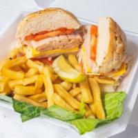 Turkey Sandwich Combo · Poultry sandwich. Includes your choice of chips, steak fries or onion rings and can pop. All...