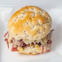 Corned Beef Hamburger · Juicy Hamburger topped with corned beef on onion roll with Swiss and Yellow American cheese....