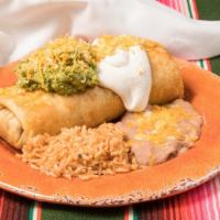 Chimichanga · Popular dish. Crispy, fried tortillas filled with shredded beef and topped with our homemade...