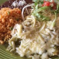 Enchilada Suizas · Popular dish. Two enchiladas loaded with chicken and covered in our delicious salsa verde (g...
