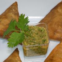 Sambusa (Lentil) · Fried pastry filled with lentil cooked in mild spicy ingredients.