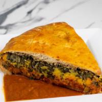 Yemama'S Ethio Savory Pie(Veggie) · A savory pie slice filled with collard greens, split peas, and lentils. Served with shiro(ch...