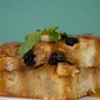 Injera Pudding · Soft dessert made from injera, bread, milk, and spices. Topped with caramel sauce, raisins, ...