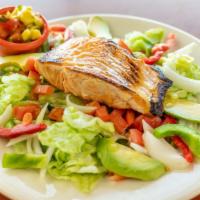 Salmon Salad · Grilled salmon fillet served on a bed of fresh greens, avocados, tomatoes, cheese, and mango...