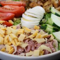 Chef Salad · Greens, turkey, ham, hard-boiled egg, cheddar, tomatoes, cucumbers, croutons.
