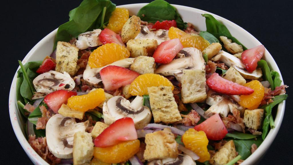 Spinach Salad · Spinach, mushrooms, red onions, bacon, mandarin oranges, strawberries, hard-boiled eggs, croutons, hot bacon dressing.