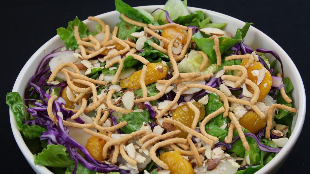 Asian Salad · Greens, shredded cabbage, water chestnuts, mandarin oranges, toasted almonds, chow mein noodles, asian sesame dressing.