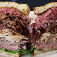 Lexi'S Tower · One pound of meat! Corned beef, roast beef, pastrami, turkey, swiss, lettuce, tomato, mayo, ...