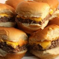 Cheeseburger Sliders · Tasty mini-burgers topped with American cheese and served with steak fries.
