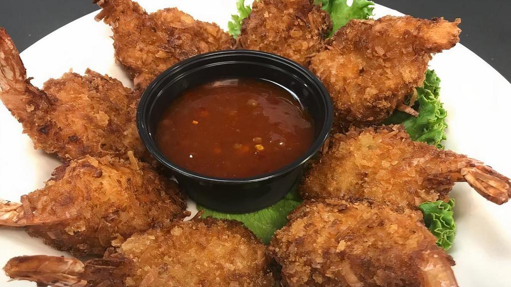 Coconut Shrimp · Butterfly shrimp lightly breaded with toasted coconut and breadcrumbs. Served with a delicious sweet red chili sauce.