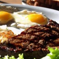 Steak & Eggs · 10oz Angus top sirloin, seasoned and chargrilled. Served with a side of breakfast potatoes, ...