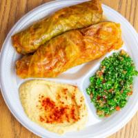Cabbage Roll · Two meat and rice cabbage rokks, hummus, tabouli, pita bread.