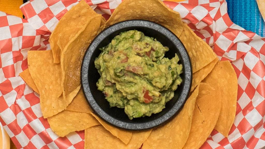 Queso & Guac · Vegetarian option available. Fresh made guacamole and queso Blanco. Served with tortilla chips.
