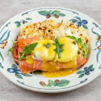 Smoked Salmon Benedict  · Cold smoked salmon, tomato, arugula on an English muffin topped with two poached eggs, Holla...