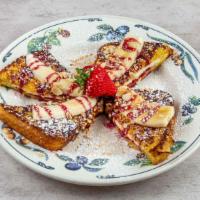 Almond-Crusted Stuffed French Toast · Our thick French toast bread, crusted with toasted almonds and filled with raspberry jam and...
