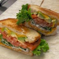 Blat · Bacon. Lettuce, avocado, tomato, cheddar, mayo, and grilled sourdough.
