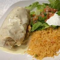 Burrito Supreme · Grilled chicken or steak, rice, refried beans, sour cream, romaine lettuce, pico de gallo.
