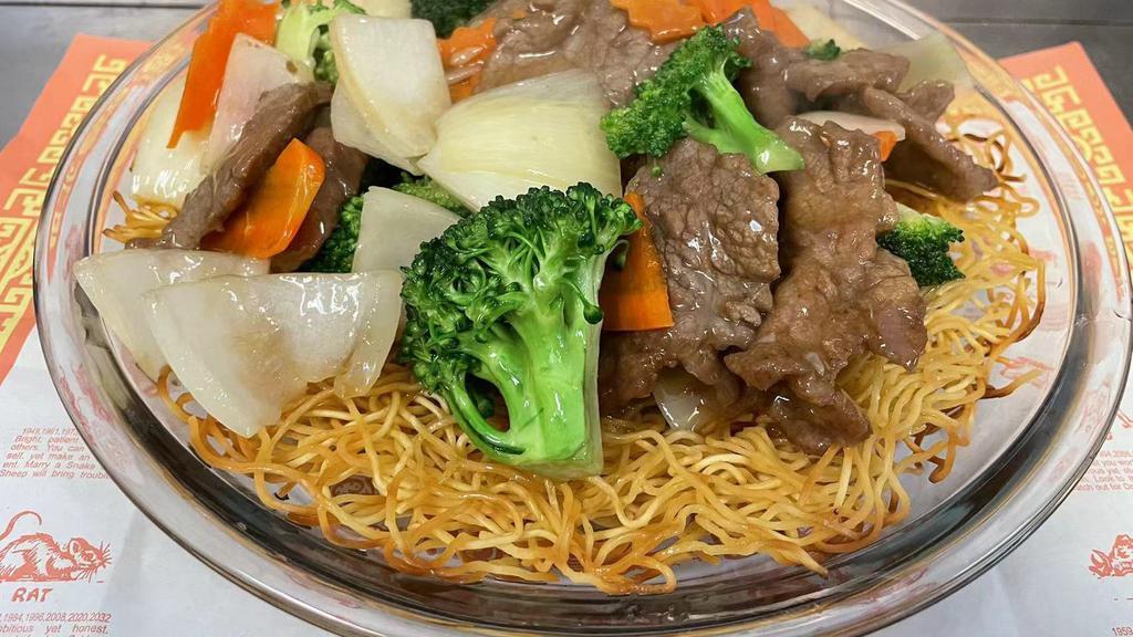 Beef Pan Fried Noodle · Broccoli, carrots, white onion with Flank Steak top of Pan Fried Noodle.....