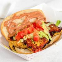 Tasty Jojo · Marinated grilled chicken resting on a hoagie bun, blanketed with lettuce, tomato, and our m...