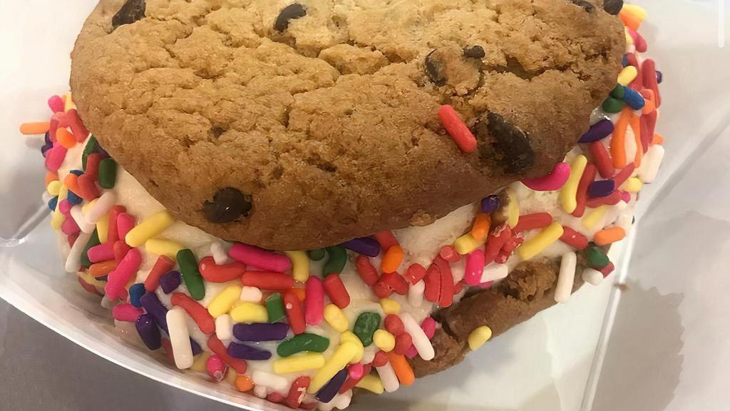 Chocolate Chip Cookie Ice Cream Sandwich · A scoop of your choice of ice cream (specify in special instructions) sandwiched between two chocolate chip cookies and rolled in rainbow sprinkles