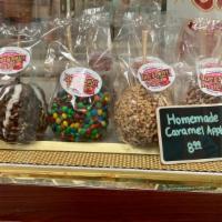 Caramel & Candy Apples · Our Famous Homemade Caramel and Candy Apples 
Plain, Peanut, M&M , Heath Bar, Apple Pie, Pec...