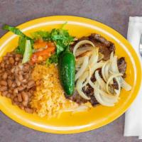 Carne Asada · Marinated steak topped with onions and jalapeno. Served with rice, beans & tortillas.