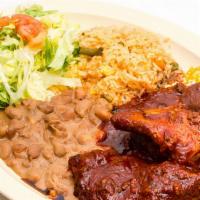 Adobo Rojo · Pork meat in red sauce. Served with rice, beans & tortillas.