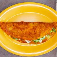 Quesadilla Enchilada · Quesadilla enchilada in red sauce. serve with onions, cilantro, sour cream and melted cheese...