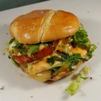 Cajun Flame · Grilled tomato, hot pepper, cheese, fresh jalapenos. Green leaf lettuce and truck-made haban...
