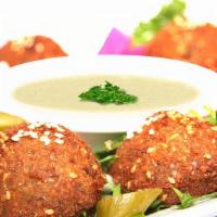 Falafel Plate · Lightly fried patties made from chickpeas, fava beans, and spices. Served with veggies and t...
