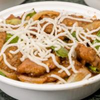 Mongolian Beef · Green and yellow onion.