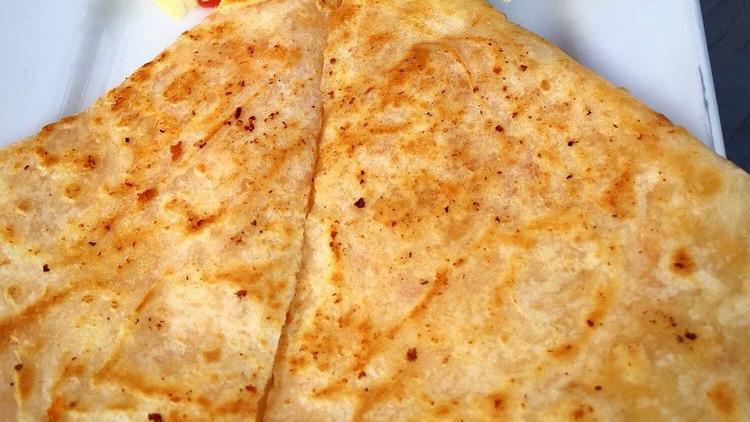Quesadilla · Grilled flour tortilla filled with shredded cheese with your choice of meat. Served with lettuce, tomatoes, sour cream, and salsa.
