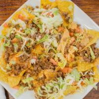 Nachos Supremos · Our special nachos with your choice of beef or chicken, topped with lettuce, tomato, jalapeñ...