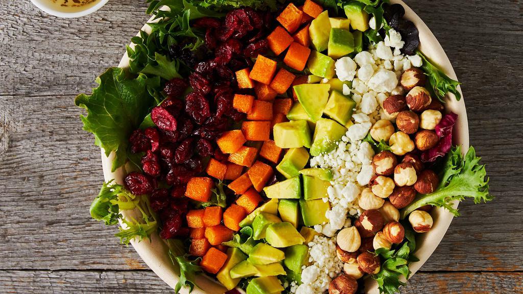 Maine Harvest Salad · Mixed greens, white balsamic vinaigrette, hazelnuts, butternut squash, dried cranberries, avocado, and crumbled goat cheese.
