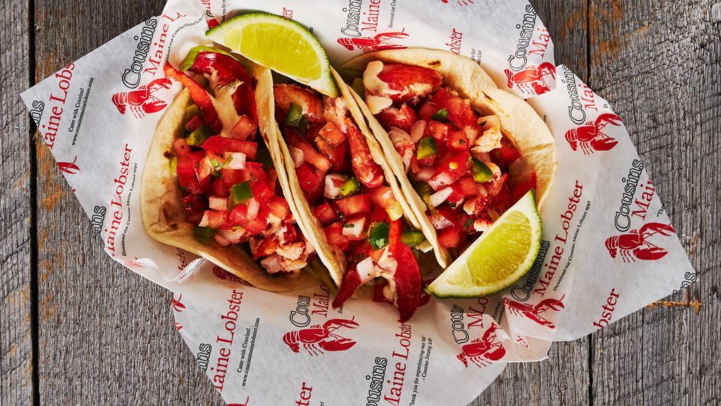 Lobster Tacos (3) · Maine lobster, served with cabbage, pico de gallo, and cilantro lime sauce, on flour tortillas. GF