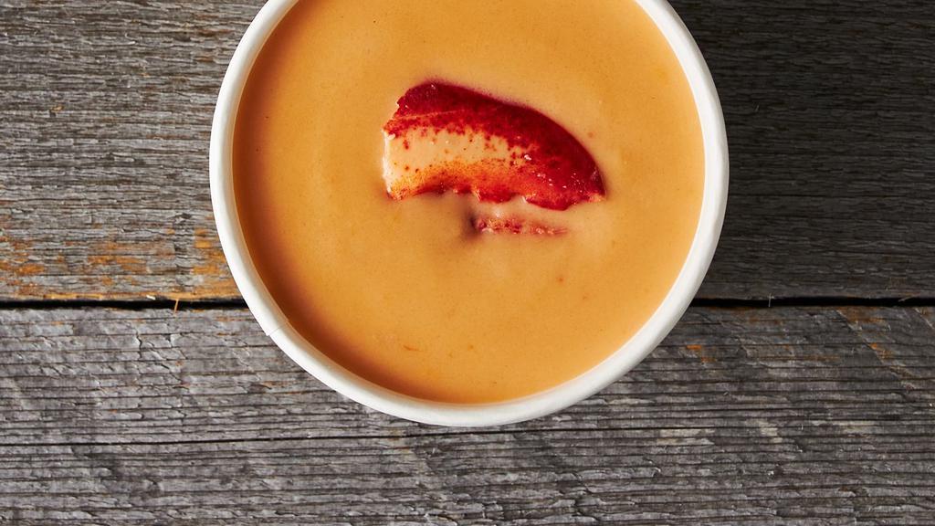 Lobster Bisque · Gluten-Free. Maine lobster in a roux-thickened stock, complemented with Spanish sherry, a light cream, and a dash of white pepper.