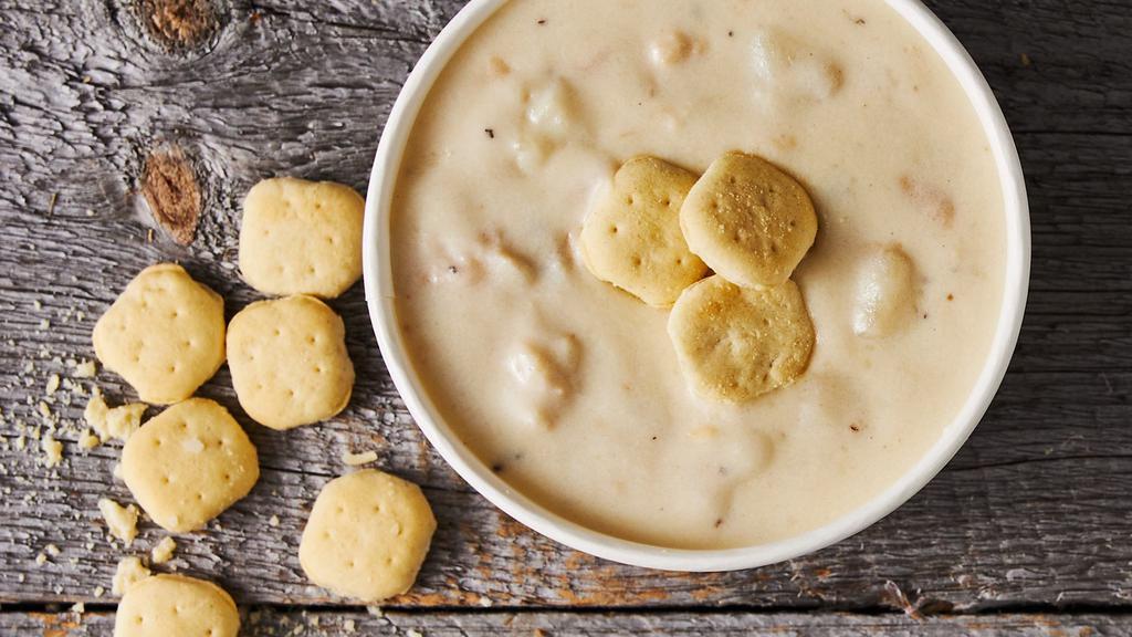New England Clam Chowder · Gluten-Free. Hand-shucked Maine clams in a rich, roux-thickened fish stock, with tempered light cream, rendered salt pork, sautéed onions, and tender potatoes.